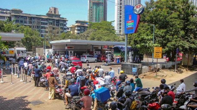 People rush with their vehicles rush to petrol pumps to fill tanks during the lockdown. (PTI)