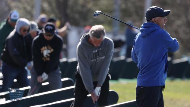 People tee off at the driving range at Eisenhower Park on March 21, 2020 in East Meadow, New York. It has been encouraged that people keep a social distance of six feet or more to curtail the spread of the coronavirus. “Clearly the virus had been circulating there for a number of weeks to have this level of penetrance into the general community,” Birx said. (Al Bello / Getty Images / AFP)