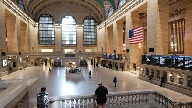 Grand Central Terminal stands mostly empty as much of the city is void of cars and pedestrians over fears of spreading the coronavirus on March 22, 2020 in New York City. With only essential workers, such as pharmacists, grocery store workers, nurses and doctors, headed to work Monday, rush hour in the city was more like a trickle of traffic. (Spencer Platt / AFP)