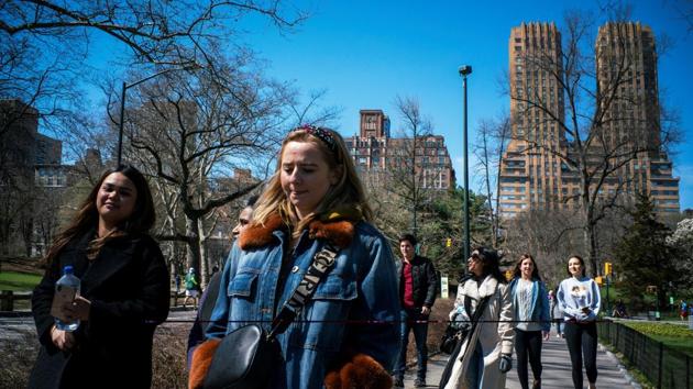 People enjoy the day at Central Park as the coronavirus disease outbreak continues in New York, on March 21, 2020. As the number of deaths in the United States from COVID-19 soared to 560, with almost 44,000 declared cases on Monday, the Big Apple found itself the US bullseye of the global pandemic. (Eduardo Munoz / REUTERS)