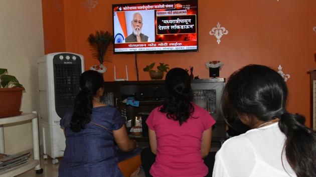 People watch Prime Minister’s address to the nation on Covid-19 outbreak, on Tuesday. (HT PHOTO) People watch Prime Minister’s address to the nation on Covid-19 outbreak, on Tuesday. (HT PHOTO)