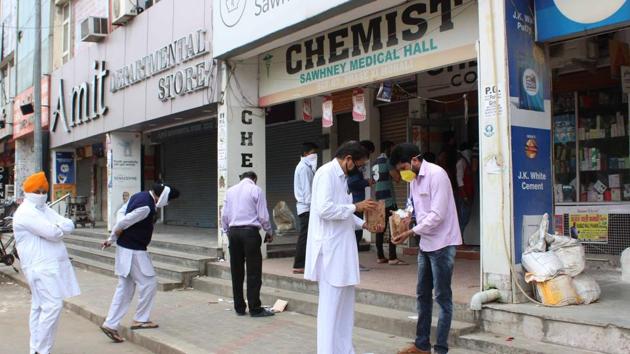 People stand in a queue to purchase medicines, Mohall on Tuesday , March 24, 2020. (Gurminder Singh / HT Photo) People stand in a queue to purchase medicines, Mohall on Tuesday , March 24, 2020. (Gurminder Singh / HT Photo)