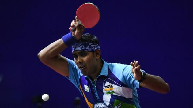 Sharath Kamal Achanta of India competes against Maharu Yoshimura of Japan. (Getty Images) Sharath Kamal Achanta of India competes against Maharu Yoshimura of Japan. (Getty Images)