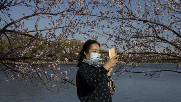 Despite the hardship, the outbreak has had at least one upside for Beijing: The slowdown in industrial activity has banished the city’s notorious pollution, leaving cobalt skies that reveal the surrounding dramatic mountain landscapes. (Ng Han Guan / AP)