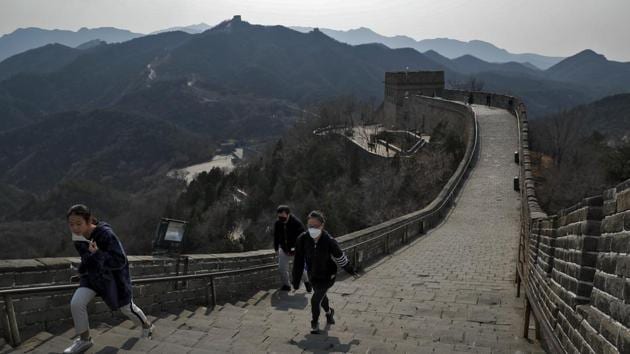 Visitors on the Badaling Great Wall of China after it reopened on March 24, 2020. Beijing's city zoo and parts of the Great Wall of China have reopened to visitors who book in advance, as the capital slowly returns to normal amid a sharp fall in the number of new coronavirus cases. (Andy Wong / AP)