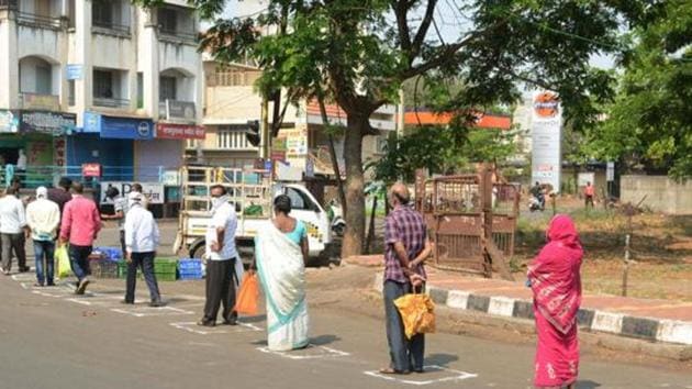 Customers stand one metre apart as a preventive measure against the novel coronavirus spread, while queuing up to buy vegetables, during total lockdown in Karad, Maharashtra on Wednesday, March 25, 2020. (PTI file photo) Customers stand one metre apart as a preventive measure against the novel coronavirus spread, while queuing up to buy vegetables, during total lockdown in Karad, Maharashtra on Wednesday, March 25, 2020. (PTI file photo)