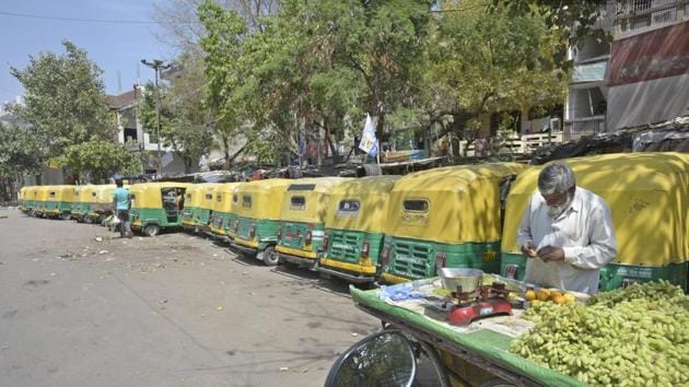 A fruit vendor besides parked auto rickshaws lining a street at I.P. Extension in New Delhi. Long queues, crowded markets, and harassment of e-commerce and food delivery people by police departments seemingly unaware of what was allowed and what wasn’t were reported, although some sense of order emerged by the evening. (Sushil Kumar / HT Photo) A fruit vendor besides parked auto rickshaws lining a street at I.P. Extension in New Delhi. Long queues, crowded markets, and harassment of e-commerce and food delivery people by police departments seemingly unaware of what was allowed and what wasn’t were reported, although some sense of order emerged by the evening. (Sushil Kumar / HT Photo)