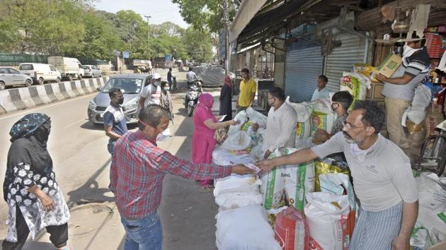 A scene from a grocer’s at Minto Road in New Delhi. Shop owners and administration across the country took various measures, from asking visitors to wear masks, to marking spots outside shops for customers to stand, to ensure social distancing. In the capital not many people were seen at stores due to the panic buying o Tuesday evening after the lockdown announcement. (Sushil Kumar / HT Photo) A scene from a grocer’s at Minto Road in New Delhi. Shop owners and administration across the country took various measures, from asking visitors to wear masks, to marking spots outside shops for customers to stand, to ensure social distancing. In the capital not many people were seen at stores due to the panic buying o Tuesday evening after the lockdown announcement. (Sushil Kumar / HT Photo)