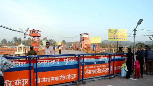 Security personnel cordoned off the entrance of Har Ki Pauri ghat to not enter the devotees after the government banned public gatherings as a preventive measure against coronavirus, in Haridwar. (ANI) Security personnel cordoned off the entrance of Har Ki Pauri ghat to not enter the devotees after the government banned public gatherings as a preventive measure against coronavirus, in Haridwar. (ANI)