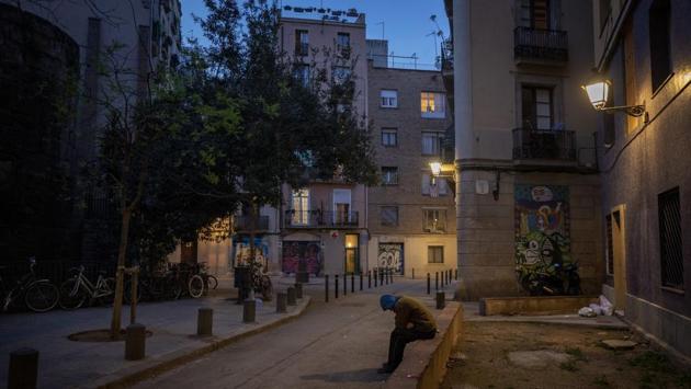 Gana Gutierrez sits in an empty street in Barcelona, Spain. “It is as if there has been a nuclear explosion and they are all sheltering in the bunker. Only us, the homeless, are left out”, 36-year-old Gana told AP. Having lived on the street for more than 8 years he commented that the slogan, “quedateencasa” (Stayathome) is only for those who have a roof over their heads but not for them. (Emilio Morenatti / AP) Gana Gutierrez sits in an empty street in Barcelona, Spain. “It is as if there has been a nuclear explosion and they are all sheltering in the bunker. Only us, the homeless, are left out”, 36-year-old Gana told AP. Having lived on the street for more than 8 years he commented that the slogan, “quedateencasa” (Stayathome) is only for those who have a roof over their heads but not for them. (Emilio Morenatti / AP)