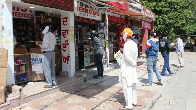 Residents maintaining appropriate distance while buying medicines at cordoned off pharmacies in Phase 3B2, Mohali. (Gurminder Singh/HT) Residents maintaining appropriate distance while buying medicines at cordoned off pharmacies in Phase 3B2, Mohali. (Gurminder Singh/HT)