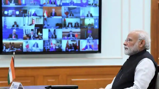 Prime Minister Narendra Modi interacting with fellow world leaders during the virtual G20 Summit to advance a coordinate global response to the COVID-19 pandemic. (PTI Photo) Prime Minister Narendra Modi interacting with fellow world leaders during the virtual G20 Summit to advance a coordinate global response to the COVID-19 pandemic. (PTI Photo)