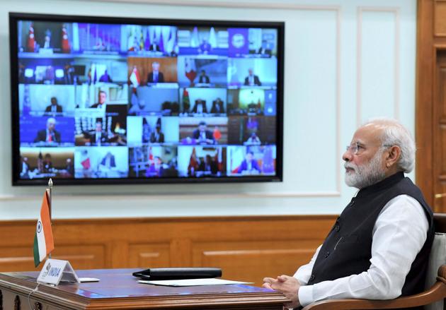Prime Minister Narendra Modi interacting with fellow world leaders during the virtual G20 Summit to advance a coordinate global response to the COVID-19 pandemic.(PTI Photo) Prime Minister Narendra Modi interacting with fellow world leaders during the virtual G20 Summit to advance a coordinate global response to the COVID-19 pandemic.(PTI Photo)