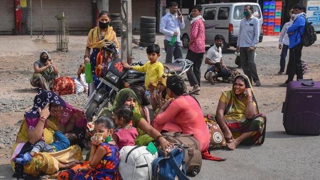 In Surat, migrant workers ( largely labourers) with their families halt alongside a road after they couldn't find transport to return home. Starved of economic opportunities, workers make their way through formal, informal, family and clan networks into a variety of jobs. Millions of women work as labourers, domestic help, cooks and cleaners. They are at particular risk of Covid-19 because they live in cramped quarters. (PTI)