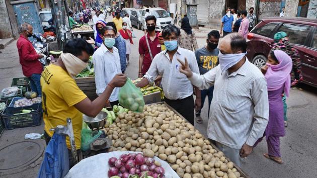 People buy groceries and vegetables at Delhi’s Sitaram Bazaar on Day 2 of the three week nationwide lockdown to check the spread of coronavirus. (Ajay Aggarwal/HT PHOTO) People buy groceries and vegetables at Delhi’s Sitaram Bazaar on Day 2 of the three week nationwide lockdown to check the spread of coronavirus. (Ajay Aggarwal/HT PHOTO)