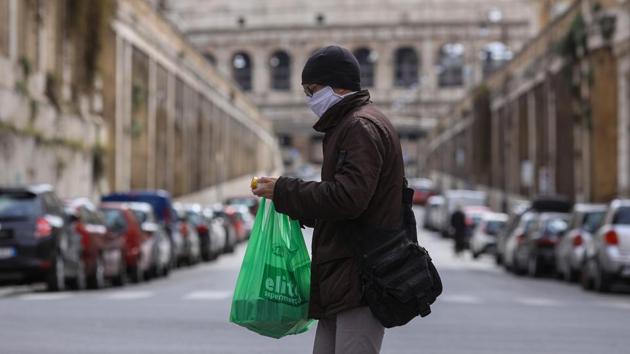 Coronavirus update: A pedestrian wearing a protective face mask crosses a road near the Colosseum in Rome, Italy on Friday. (Bloomberg Photo) Coronavirus update: A pedestrian wearing a protective face mask crosses a road near the Colosseum in Rome, Italy on Friday. (Bloomberg Photo)