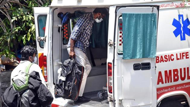 Kerala, Mar 15 (ANI): Passengers wearing masks keep luggage inside the ambulance outside the isolation ward of coronavirus patients, at Aluva government general hospital, in Kochi on Sunday. (ANI Photo)(ANI)
