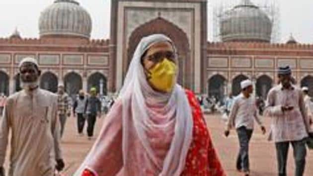 A Muslim woman wearing a protective mask following an outbreak of the coronavirus disease leaves after attending the Friday prayers at the Jama Masjid in the old quarters of Delhi on March 20, 2020.(Reuters file photo)