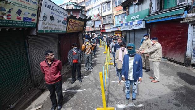 With vehicles not allowed, people had to walk to the main market, with supplies running out in some of the smaller grocery stores.(HT Photo)