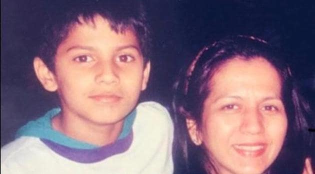 Varun Dhawan with his mother in a childhood photo. Varun Dhawan with his mother in a childhood photo.