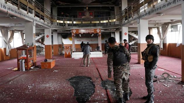 Afghan security personnel inspect inside a Sikh religious complex after an attack in Kabul, Afghanistan on March 25, 2020.(REUTERS)