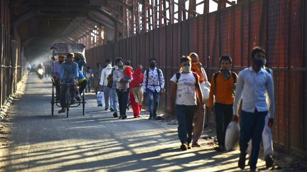 The iron bridge in East Delhi, full of migrants on foot, on March 27. An official in the labour ministry said on condition of anonymity that some changes in some of the lockdown restrictions to help migrant workers are expected in the next couple of days. (Sonu Mehta / HT Photo) The iron bridge in East Delhi, full of migrants on foot, on March 27. An official in the labour ministry said on condition of anonymity that some changes in some of the lockdown restrictions to help migrant workers are expected in the next couple of days. (Sonu Mehta / HT Photo)