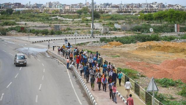 A stream of people makes the long walk home, from New Delhi. The government is working to help migrant workers and their families get to their destination or, at the least, to also ensure they get food and shelter. (Amal KS / HT Photo) A stream of people makes the long walk home, from New Delhi. The government is working to help migrant workers and their families get to their destination or, at the least, to also ensure they get food and shelter. (Amal KS / HT Photo)