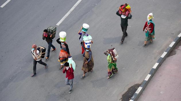 A top shot of migrant workers headed home, at NH 24, in New Delhi. (Raj K Raj / HT Photo) A top shot of migrant workers headed home, at NH 24, in New Delhi. (Raj K Raj / HT Photo)
