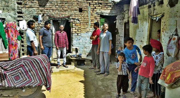 Labourers and their children at a labour quarter on Barewal road in Ludhiana. (Gurpreet Singh/HT) Labourers and their children at a labour quarter on Barewal road in Ludhiana. (Gurpreet Singh/HT)