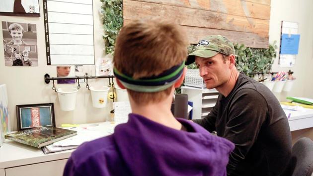 Tyler McClenahan, a high school basketball coach, and son Max, 10, work on a school lesson at home during Washington Governor's "stay home, stay healthy" initiative as efforts continue to help slow the spread of coronavirus disease (COVID-19) in Seattle, Washington. (REUTERS) Tyler McClenahan, a high school basketball coach, and son Max, 10, work on a school lesson at home during Washington Governor's "stay home, stay healthy" initiative as efforts continue to help slow the spread of coronavirus disease (COVID-19) in Seattle, Washington. (REUTERS)