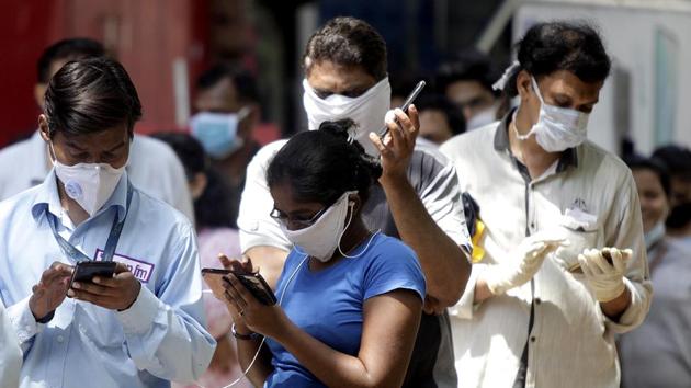 People wear protective mask as they arrive to buying vegetables during Lockdown by the government to amid concerns over the spread of the COVID-19 novel coronavirus, in Mumbai on Tuesday.(ANI photo for representation)