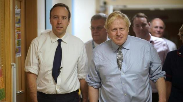 Britain's Prime Minister Boris Johnson, right, has tested positive for Covid-19. (AP File) Britain's Prime Minister Boris Johnson, right, has tested positive for Covid-19. (AP File)