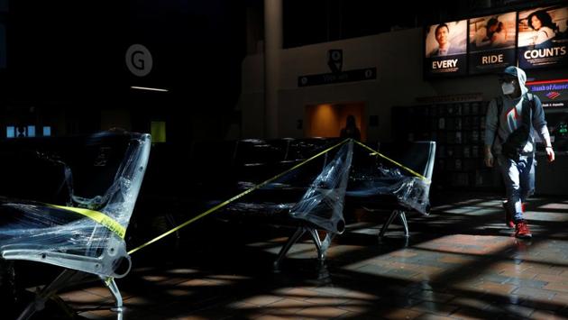A rail passenger wearing a mask walks past a plastic-wrapped series of benches after Mayor Muriel Bowser declared a State of Emergency, inside Union Station in Washington D.C. Nurses at Mount Sinai Hospital in New York said they were locking away or hiding N-95 respirator masks, surgical masks and other supplies prone to pilfering if left unattended. “Masks disappear,” nurse Diana Torres said. (Tom Brenner / REUTERS) A rail passenger wearing a mask walks past a plastic-wrapped series of benches after Mayor Muriel Bowser declared a State of Emergency, inside Union Station in Washington D.C. Nurses at Mount Sinai Hospital in New York said they were locking away or hiding N-95 respirator masks, surgical masks and other supplies prone to pilfering if left unattended. “Masks disappear,” nurse Diana Torres said. (Tom Brenner / REUTERS)