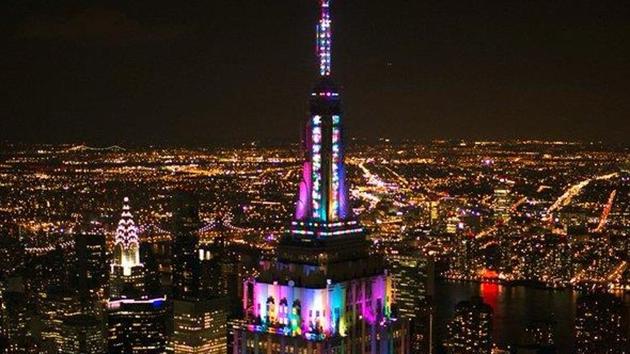 The Empire State Building is lit up in bright colours as part of a drive to lift the spirits of New Yorkers. (@EmpireStateBldg/Twitter Photo) The Empire State Building is lit up in bright colours as part of a drive to lift the spirits of New Yorkers. (@EmpireStateBldg/Twitter Photo)