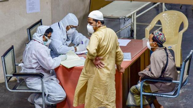 Medics interact with tourists at a COVID-19 helpdesk in the wake of coronavirus at Hyderabad Gandhi Hospital.(PTI File Photo)