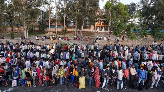 Serpentine queues at the Anand Vihar interstate bus terminal where tens of thousands of migrant workers gathered to be taken home in government buses. (Biplov Bhuyan / HT Photo) Serpentine queues at the Anand Vihar interstate bus terminal where tens of thousands of migrant workers gathered to be taken home in government buses. (Biplov Bhuyan / HT Photo)