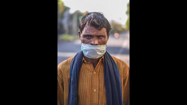 Gajram, 30, walking to Ranchi from Ashram in Delhi. He said he was travelling with his family members and carrying two rupees on him. (Biplov Bhuyan / HT Photo) Gajram, 30, walking to Ranchi from Ashram in Delhi. He said he was travelling with his family members and carrying two rupees on him. (Biplov Bhuyan / HT Photo)