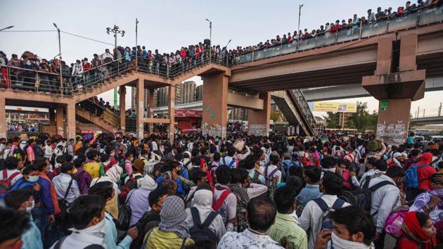Anand Vihar bus terminal saw tens of thousands of migrant workers assembled in a desperate attempt to get on buses organized by the UP government to take them home. Social distancing was, obviously, a distant possibility as one can see in this image. (Biplov Bhuyan / HT Photo) Anand Vihar bus terminal saw tens of thousands of migrant workers assembled in a desperate attempt to get on buses organized by the UP government to take them home. Social distancing was, obviously, a distant possibility as one can see in this image. (Biplov Bhuyan / HT Photo)