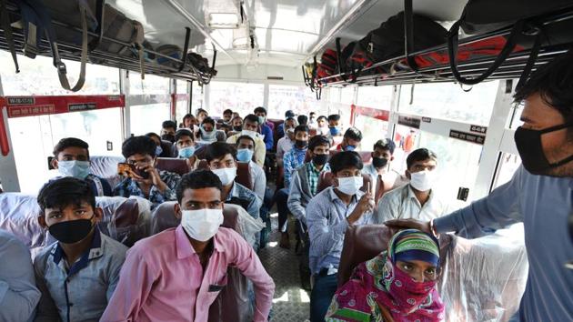 Migrant workers seen inside a bus bound to their native state at Kaushambi Roadways Bus Stand on the DelhiUP border (Ajay Aggarwal/HT PHOTO) Migrant workers seen inside a bus bound to their native state at Kaushambi Roadways Bus Stand on the DelhiUP border (Ajay Aggarwal/HT PHOTO)