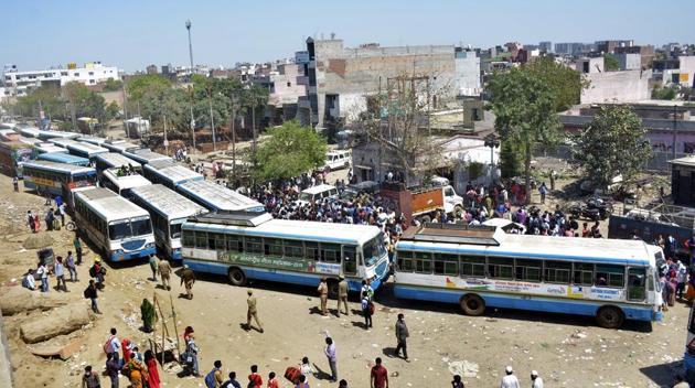 An aerial view of the Lal Kuan bus stand where migrant workers are seen heading to their native states on buses arranged by the Uttar Pradesh government, on Day 5 of the 21 day nationwide lockdown imposed by PM Narendra Modi to curb the spread of coronavirus, in Ghaziabad. (Sakib Ali / HT Photo) An aerial view of the Lal Kuan bus stand where migrant workers are seen heading to their native states on buses arranged by the Uttar Pradesh government, on Day 5 of the 21 day nationwide lockdown imposed by PM Narendra Modi to curb the spread of coronavirus, in Ghaziabad. (Sakib Ali / HT Photo)