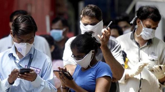 People wear protective mask as they arrive to buying vegetables during Lockdown by the government in Mumbai.(ANI)