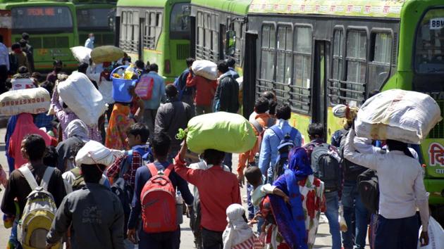A wave of migrant workers seen at Anand Vihar Bus Terminus as they head to their native state on Day 5 of the 21 day nationwide lockdown imposed by PM Modi to curb the spread of coronavirus, in New Delhi on March 29, 2020.(Photo by Sakib Ali /HT file photo) A wave of migrant workers seen at Anand Vihar Bus Terminus as they head to their native state on Day 5 of the 21 day nationwide lockdown imposed by PM Modi to curb the spread of coronavirus, in New Delhi on March 29, 2020.(Photo by Sakib Ali /HT file photo)
