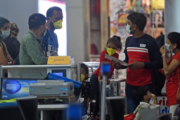 Passengers wearing facemasks amid concerns over the spread of the COVID-19 novel coronavirus at the Goa airport .(AFP File Photo) Passengers wearing facemasks amid concerns over the spread of the COVID-19 novel coronavirus at the Goa airport .(AFP File Photo)