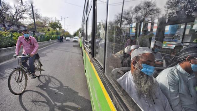 People who took part in a Tablighi Jamaat event earlier this month on board buses taking them to a quarantine facility amid concerns of infection, on day seven of the 21 day nationwide lockdown. (Biplov Bhuyan / HT Photo) People who took part in a Tablighi Jamaat event earlier this month on board buses taking them to a quarantine facility amid concerns of infection, on day seven of the 21 day nationwide lockdown. (Biplov Bhuyan / HT Photo)