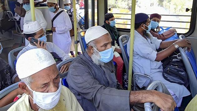 Nizamuddin congregants being taken to LNJP hospital for Covid-19 tests. (PTI Photo) Nizamuddin congregants being taken to LNJP hospital for Covid-19 tests. (PTI Photo)