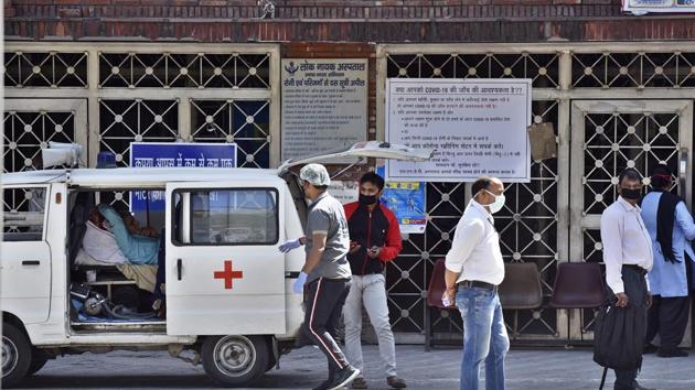 Local residents are seen wearing protective masks outside the OPD at Lok Nayak Jai Prakash Narayan Hospital (LNJP), on Day 6 of the 21 day nationwide lockdown in New Delhi on March 30, 2020. (Sanjeev Verma/HT file photo) Local residents are seen wearing protective masks outside the OPD at Lok Nayak Jai Prakash Narayan Hospital (LNJP), on Day 6 of the 21 day nationwide lockdown in New Delhi on March 30, 2020. (Sanjeev Verma/HT file photo)