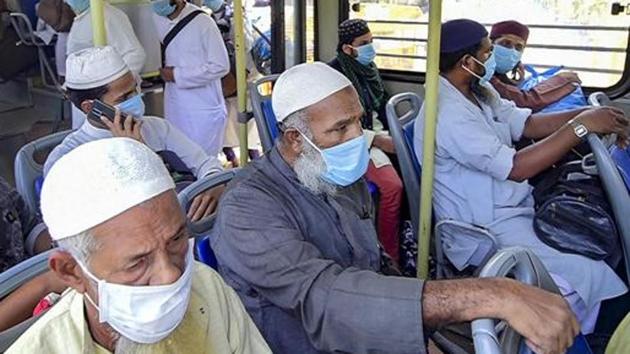 People who came for ‘Jamat’, a religious gathering at Nizamuddin Mosque, being taken to LNJP hospital for COVID-19 test, after several people showed symptoms of coronavirus, during a nationwide lockdown, in New Delhi.(PTI)