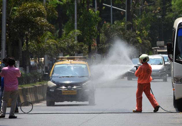Mumbai fire brigade personnel sanitize area Machimar Colony, to preventive measure from coronavirus disease at Colaba, in Mumbai.(Bhushan Koyande/ HT Photo) Mumbai fire brigade personnel sanitize area Machimar Colony, to preventive measure from coronavirus disease at Colaba, in Mumbai.(Bhushan Koyande/ HT Photo)