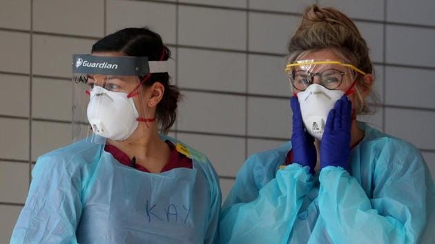 Medical staff wearing protective gear at a hospital in London amid the coronavirus pandemic.(REUTERS PHOTO.)