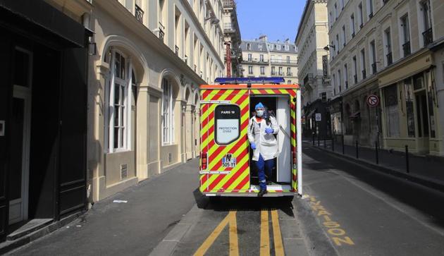 Cyril Lamriben, a member of the Civil Protection service, steps out of an ambulance on his way to check a woman possibly infected with the Covid-19 virus in Paris. They don't have to put themselves in harm's way, but the volunteers of France's well-known Civil Protection service choose the front line in the fight against the coronavirus. (Michel Euler / AP) Cyril Lamriben, a member of the Civil Protection service, steps out of an ambulance on his way to check a woman possibly infected with the Covid-19 virus in Paris. They don't have to put themselves in harm's way, but the volunteers of France's well-known Civil Protection service choose the front line in the fight against the coronavirus. (Michel Euler / AP)